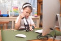 Asian Boy Child Wearing Headphones Using Microphone With Computer Prepare To Making Video Call To Relatives At Home Or Making Vlog
