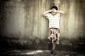 Asian boy crying alone at old wall ,vintage tone Royalty Free Stock Photo