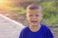 Asian boy crying on the street Royalty Free Stock Photo