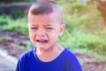 Asian boy crying on the street Royalty Free Stock Photo