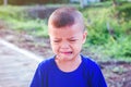 Asian boy crying on the street Royalty Free Stock Photo