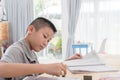 Asian boy doing homework at home Royalty Free Stock Photo