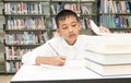 Asian boy doing homework . Royalty Free Stock Photo