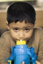 Asian boy drinking