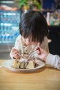Asian boy eating honey toast Royalty Free Stock Photo