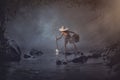 Asian boy fishing in the creek Royalty Free Stock Photo