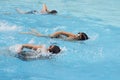 Asian boy front crawl swims in swimming pool Royalty Free Stock Photo