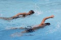 Asian boy front crawl swims in swimming pool Royalty Free Stock Photo