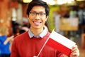 Asian boy in glasses holding flag of Poland Royalty Free Stock Photo
