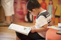 Asian boy with glasses read book Royalty Free Stock Photo