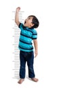 Asian boy growing tall measuring Royalty Free Stock Photo