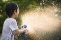 Asian boy has fun playing in water Royalty Free Stock Photo