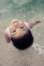 Asian boy having fun on beach