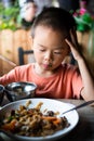 Asian boy having lunch at the restaurant Royalty Free Stock Photo