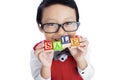 Asian boy hold SALE wooden alphabet toy - isolated