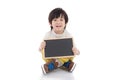 Asian boy holding black board on white background isolated Royalty Free Stock Photo