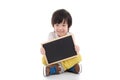 Asian boy holding black board on white background isolated Royalty Free Stock Photo