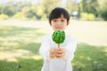 Asian boy holding recycled paper tree to promote eco lifestyle. Gyre