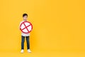 Asian boy holding red stop or no sign Royalty Free Stock Photo