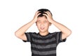 Asian boy kid holding his head frowning with screaming. pulling Royalty Free Stock Photo