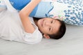 Asian boy laying on floor. Royalty Free Stock Photo