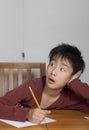Asian boy making funny face at bug Royalty Free Stock Photo