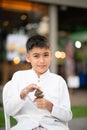 Asian boy play the ranat ek Thai musical xylophone instrument in the percussion