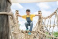 Asian boy play slider toy in playground Royalty Free Stock Photo