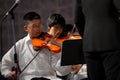Asian boy play the violin