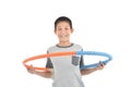 Asian boy playing with the hulahoop on a white Royalty Free Stock Photo