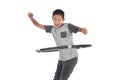 Asian boy playing with the hulahoop on a white Royalty Free Stock Photo