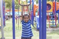 Asian boy playing monkey bars in the playground. Royalty Free Stock Photo