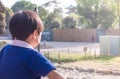 Asian boy is playing in playground in park Royalty Free Stock Photo