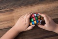 Asian boy playing with rubik`s cube.boy solving puzzle