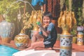 Asian boy is playing with splash water gun on a swimming pool in Thailand tropical resort Royalty Free Stock Photo