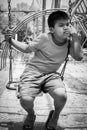 Asian boy sad alone at playground Royalty Free Stock Photo
