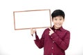 Asian boy smiling and hand holding blank board. Royalty Free Stock Photo