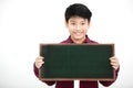 Asian boy smiling and hand holding blank board. Royalty Free Stock Photo