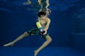 Asian boy with squirt gun under water Royalty Free Stock Photo