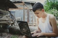 Asian boy studying online with laptop computer on his desk at home countryside, Learning with teacher at home, Homeschooling