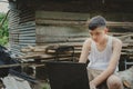 Asian boy studying online with laptop computer on his desk at home countryside, Learning with teacher at home, Homeschooling