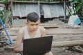 Asian boy studying online with laptop computer on his desk at home countryside, Learning with teacher at home, Homeschooling