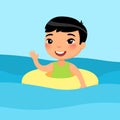 Asian boy swimming with inflatable ring flat vector illustration