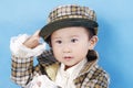 asian boy in tartan dress Royalty Free Stock Photo