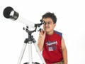 Asian boy with a telescope Royalty Free Stock Photo