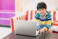 Asian boy using Laptop computer for online study homeschooling during home quarantine. homeschooling, online study, home