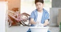 Asian boy washing his towel by hand. Royalty Free Stock Photo