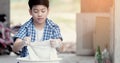 Asian boy washing his towel by hand. Royalty Free Stock Photo