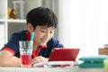 Asian boy watching on tablet computer ,smile face . Royalty Free Stock Photo