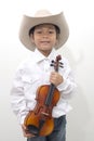 Asian boy wearing a cowboy hat holding a violin Royalty Free Stock Photo